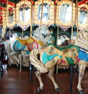 a group of horses on a carousel