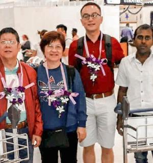 a group of people standing in a store with carts