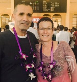 a man and a woman posing for a picture