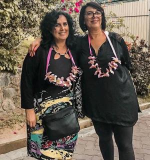 two women are standing next to each other