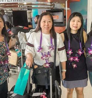 a group of three women standing next to each other