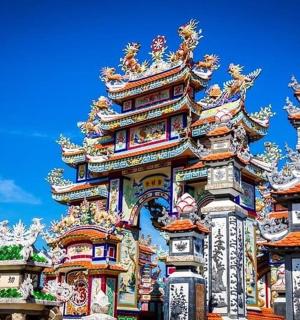 a building with ornate architecture with a blue sky in the background