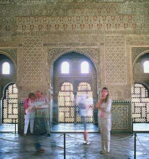 a group of people standing inside of a building