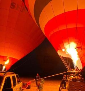 a group of hot air balloons being inflated