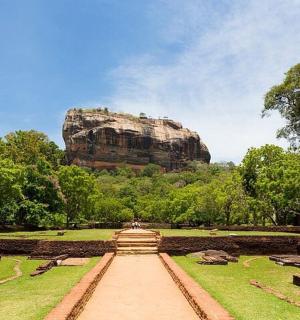 a view of a large rock in a park
