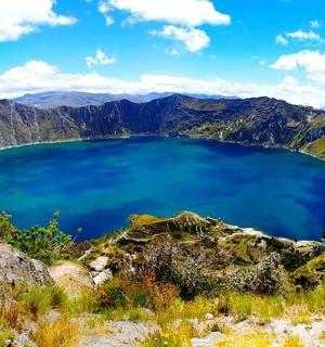 a view of a blue lake in the mountains
