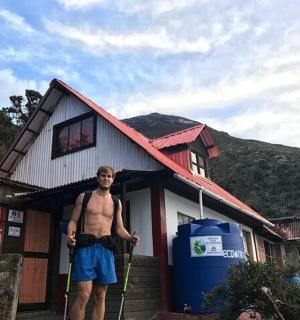 a man standing in front of a house