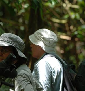 two men are looking at something in a camera