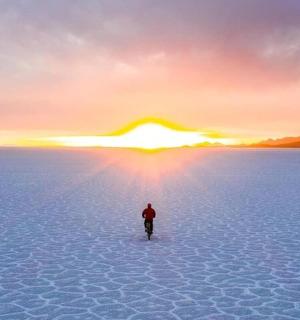 a person standing in the middle of a desert