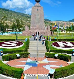 a monument in a park with a clock tower