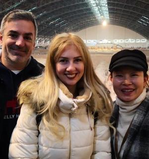a man and a woman standing in a stadium