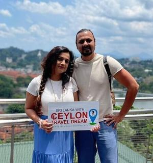 a man and a woman holding up a sign