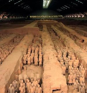 a group of people standing in a large arena