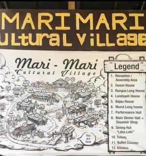 a sign for a marmite cultural village in a park