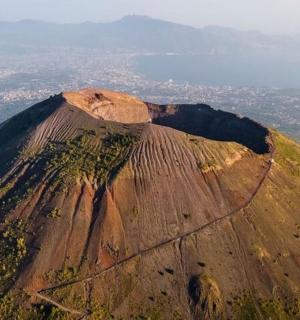 an aerial view of a mountain with a town