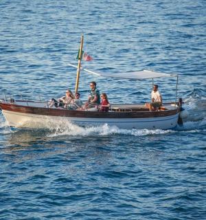 a group of people on a boat in the water