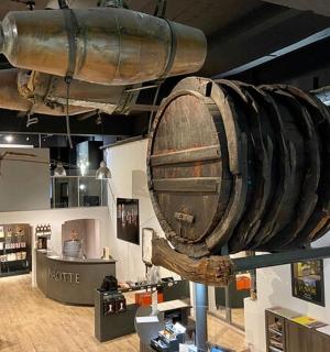 a large wooden barrel on display in a museum