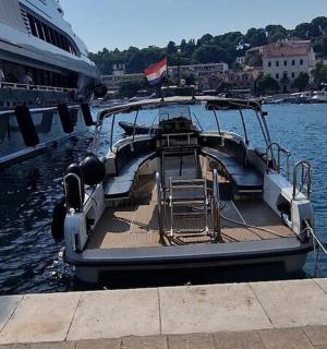 a boat is docked next to a cruise ship