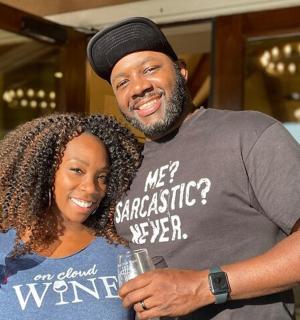a man and a woman holding a glass of wine