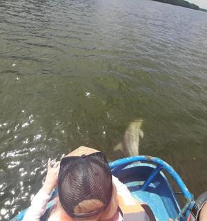 a couple of people in a boat in the water