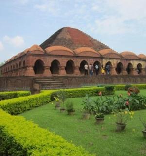 a building with a garden in front of it
