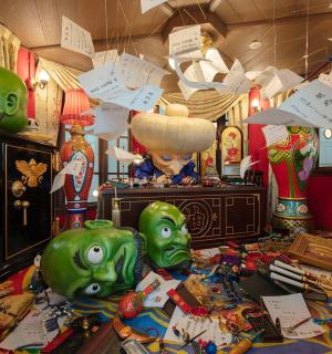 a room with two green pigs on a table