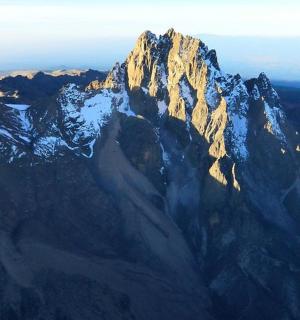 an aerial view of a mountain with snow on it