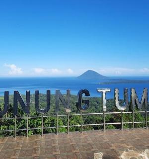 a sign that reads guumbopol island in the ocean