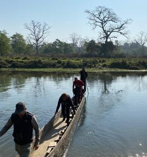 a group of people in a boat in the water