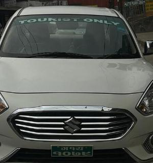 a white car is parked on a street