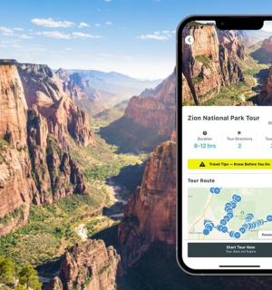two cell phones with a view of a canyon