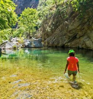 a person walking in the water in a river