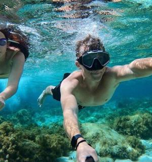 a man and woman swimming in the water