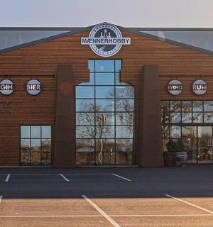 a building with a tennis court in front of it