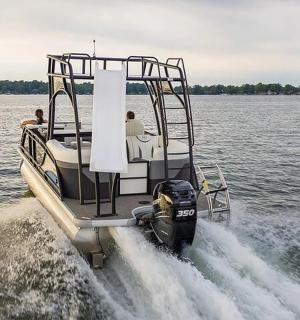 a boat in the water with two people on it