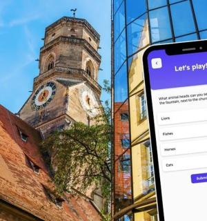 ein Handy vor einem Uhrenturm