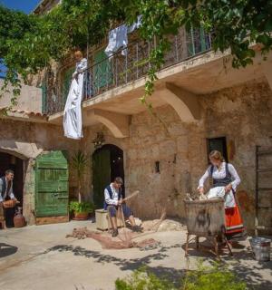 a group of people sitting outside of a building