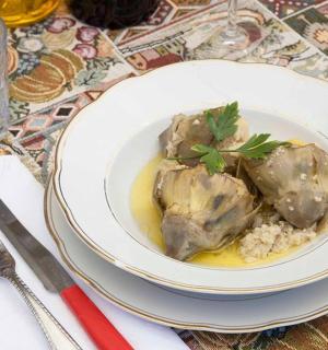 a plate of food with meat and rice on a table