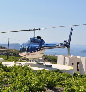 a blue helicopter sitting on top of a building