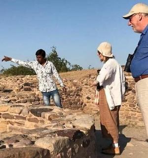 a group of people standing on top of a wall