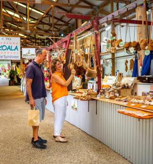 a man and a woman standing in a market