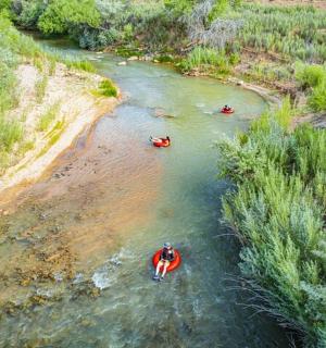 a group of people in kayaks in a river