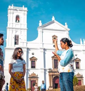 a group of people standing in front of a church