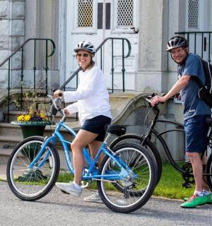 a man and a woman on a blue bike