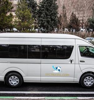 a white van is parked in a parking lot