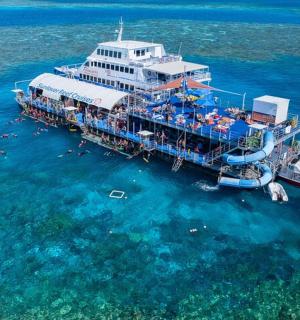 a cruise ship in the water with people on it