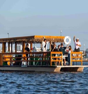 a group of people on a boat in the water