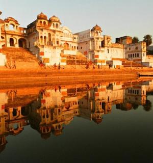 a building with its reflection in a body of water