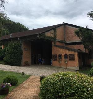 a large brick building with a driveway in front of it