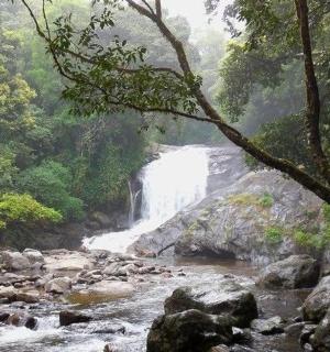 a waterfall in the middle of a river